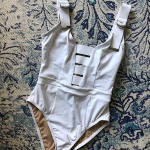 Karla Colletto one piece suit in white.